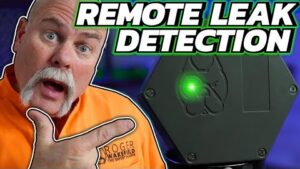 Plumber demonstrating advanced remote leak detection technology for locating hidden water leaks without invasive digging