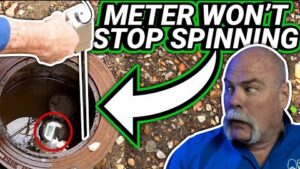 Water meter spinning continuously as plumber demonstrates how to find a hidden water leak using your home's water meter