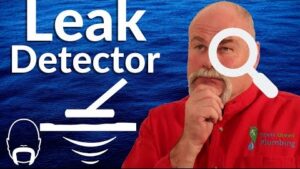 Plumber explaining professional water leak detection methods and equipment used to locate hidden plumbing leaks